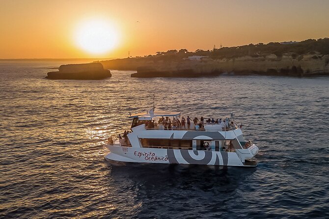 Albufeira: 6-Hour Sunset Dinner Catamaran Cruise with Open Bar - Coastal sailing to Benagil: what the cave stop is good for